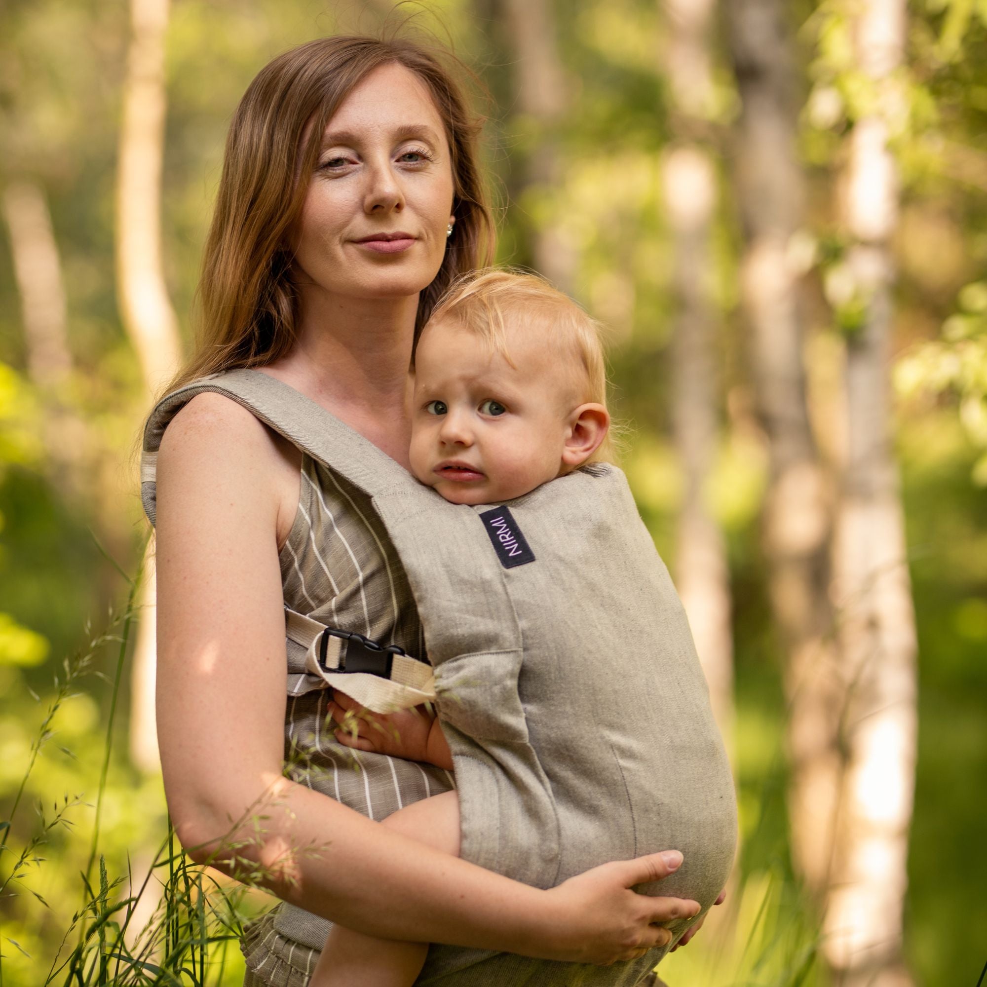 NIRMI baby carrier + €50 voucher for a patch of your choice